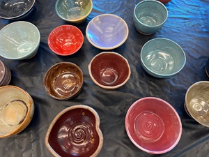 An assortment of colorful handmade bowls on a table