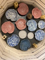 Assorted handmade blue, pink and white bowls at the Empty Bowls event