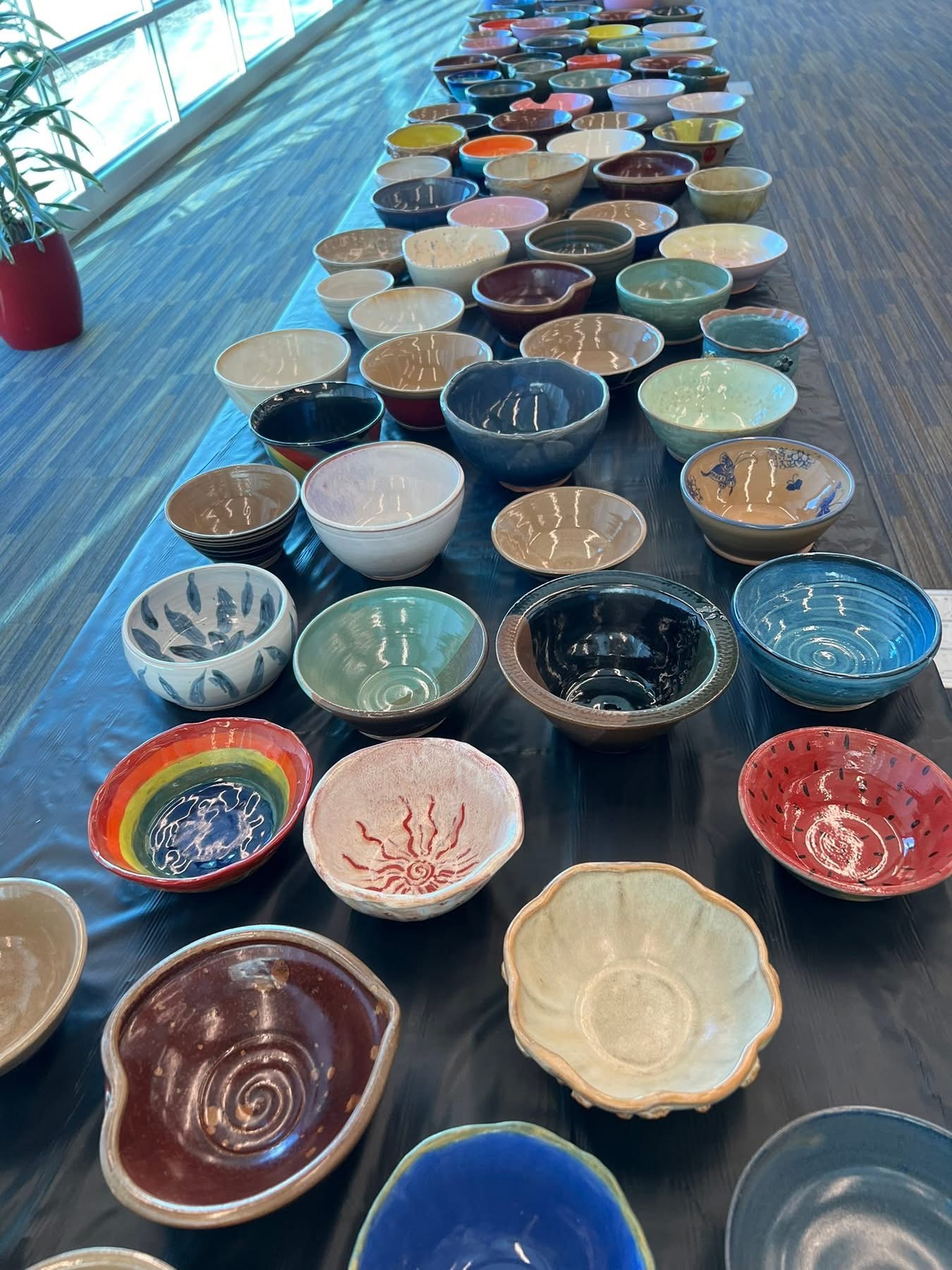 Colorful bowls for sale on a black table
