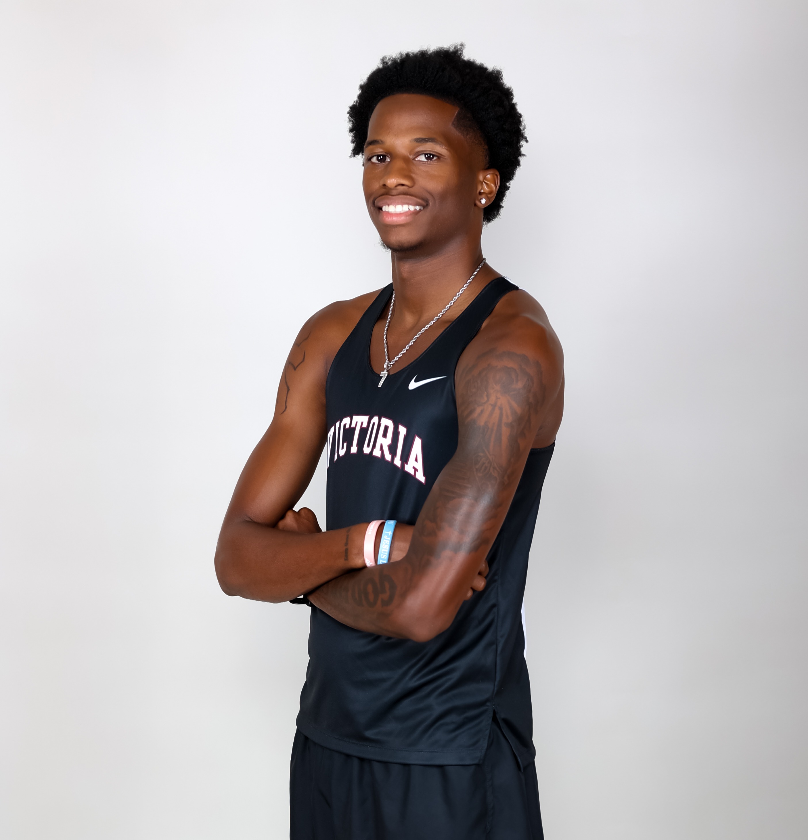 Kameron Mitchell smiling in his black VC uniform
