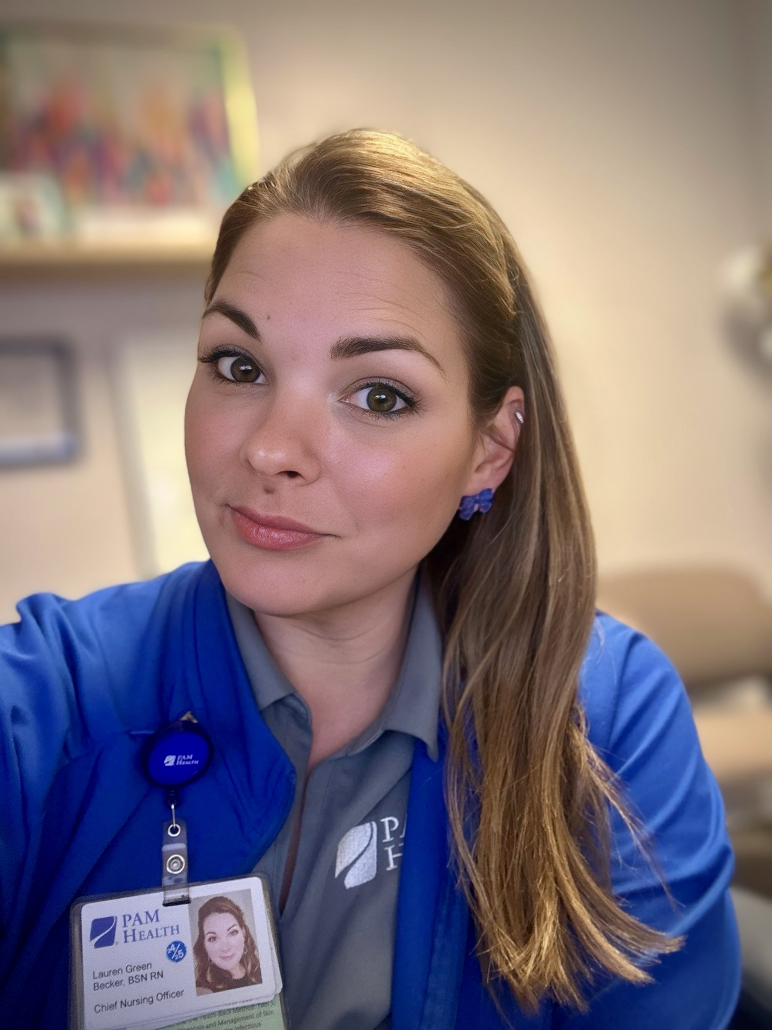 Lauren Green Becker in her PAM Health uniform scrubs