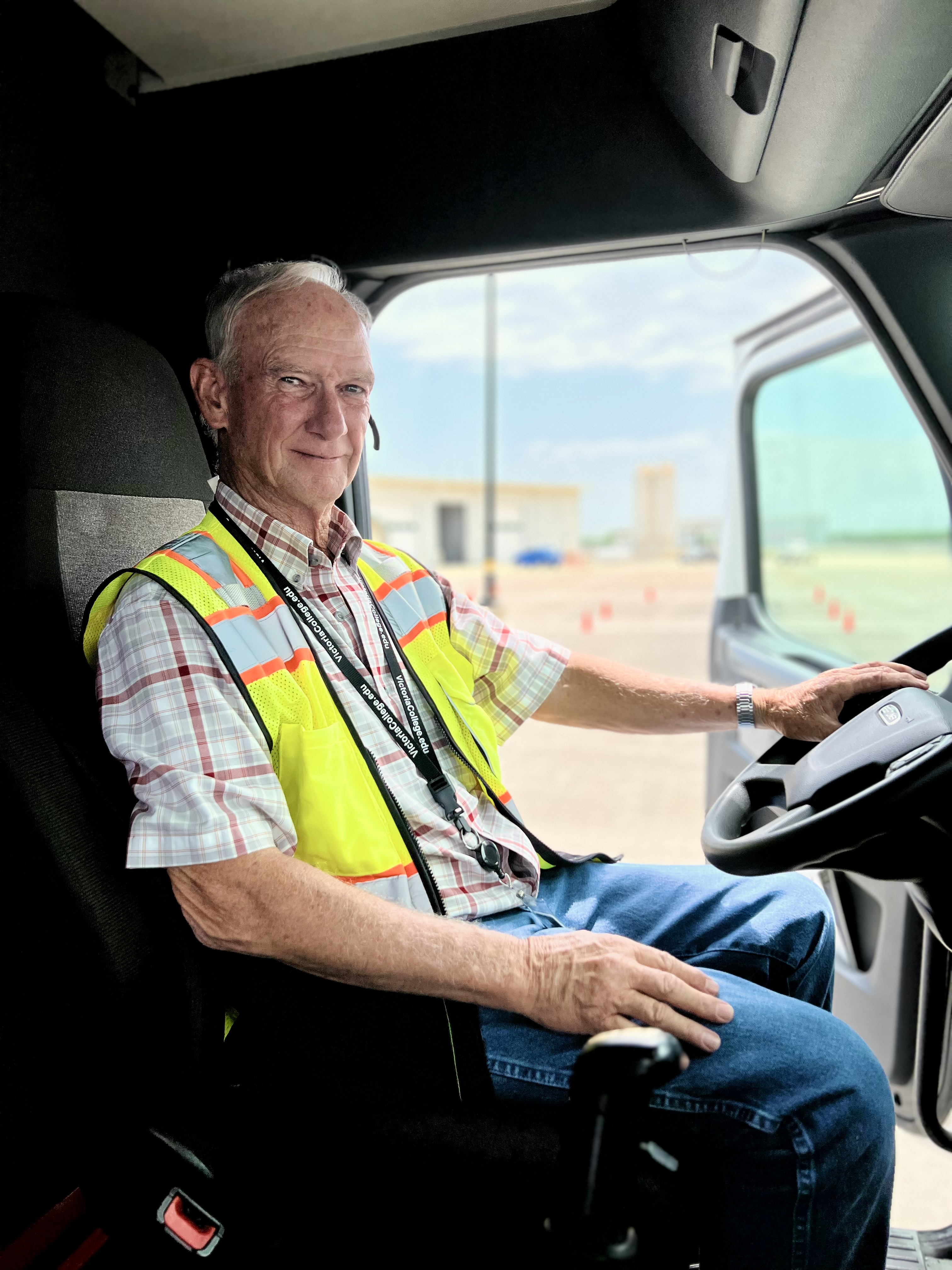 Rocky Pullin stands beside a VC truck