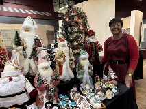 Vendor at the 2024 Artisan's Market selling santas