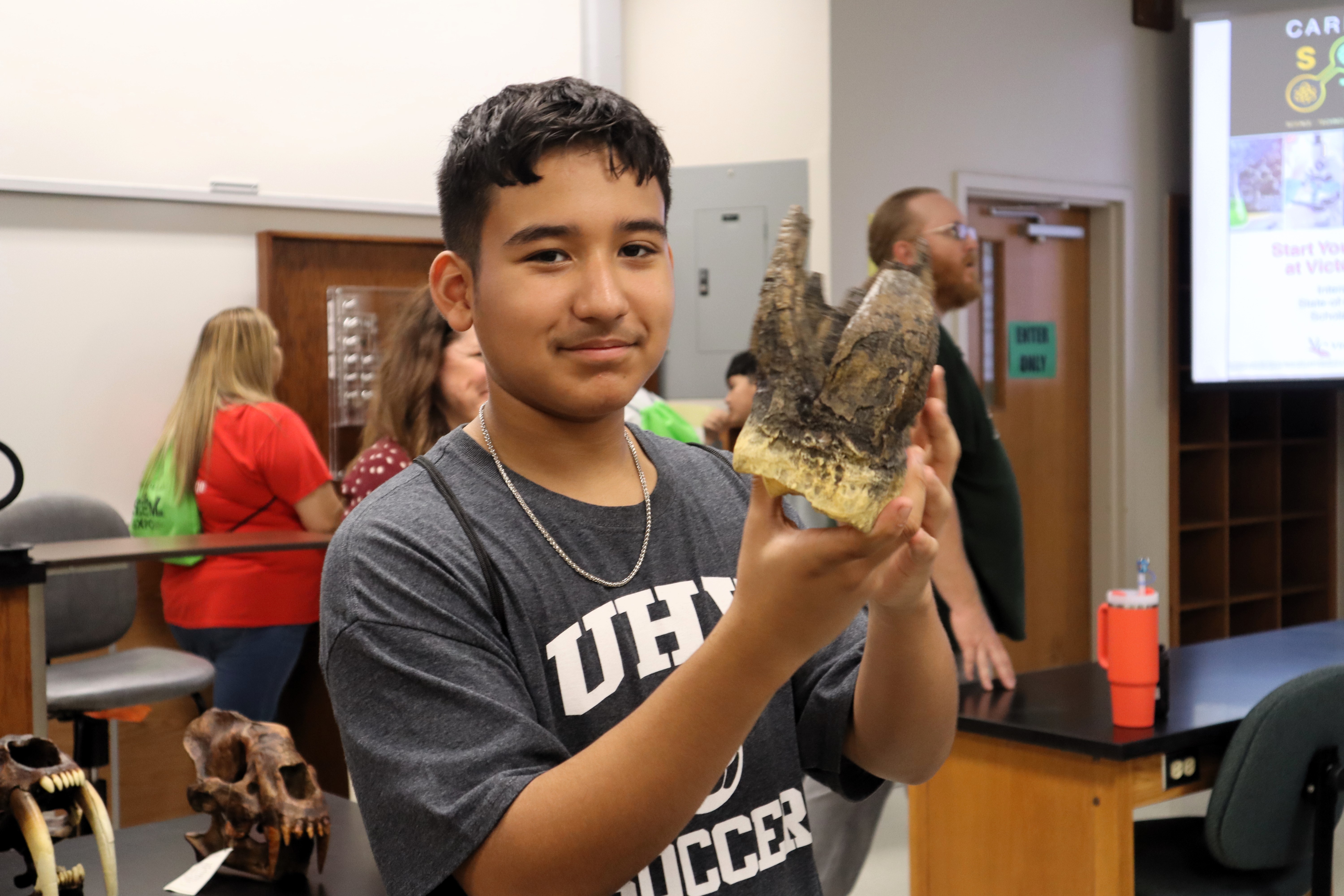 VISD student holds a skeleton